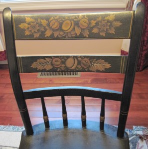 Circa 1850s wooden chair, black with stenciling on chair back
